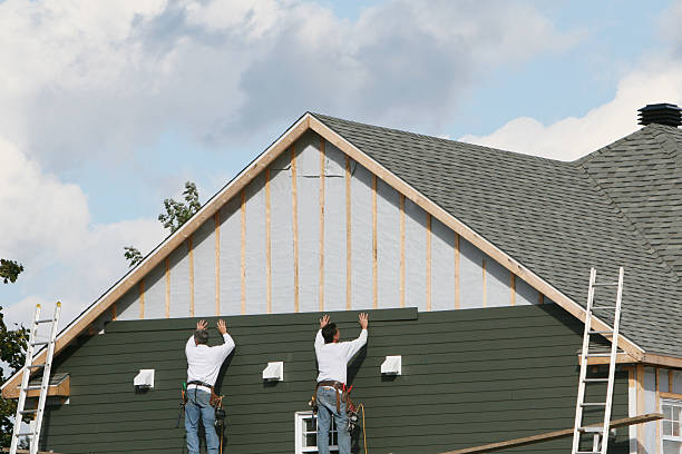 Professional Storm Damage Siding Repair technician working in Belle Center, OH